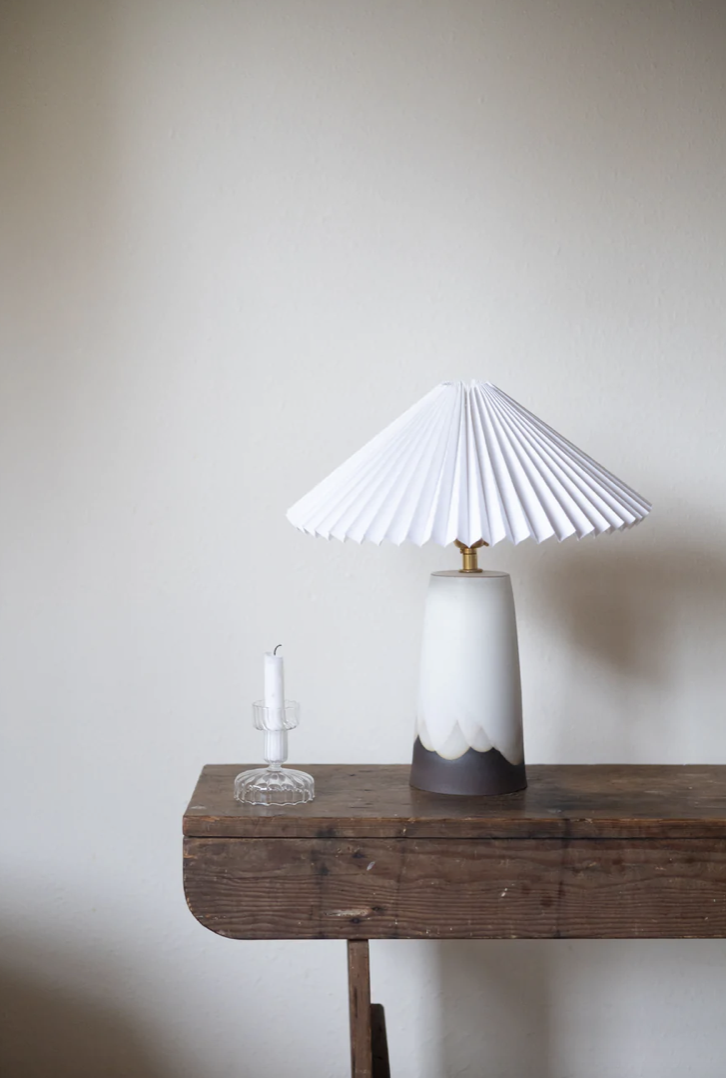 white ceramic lamp on wooden table