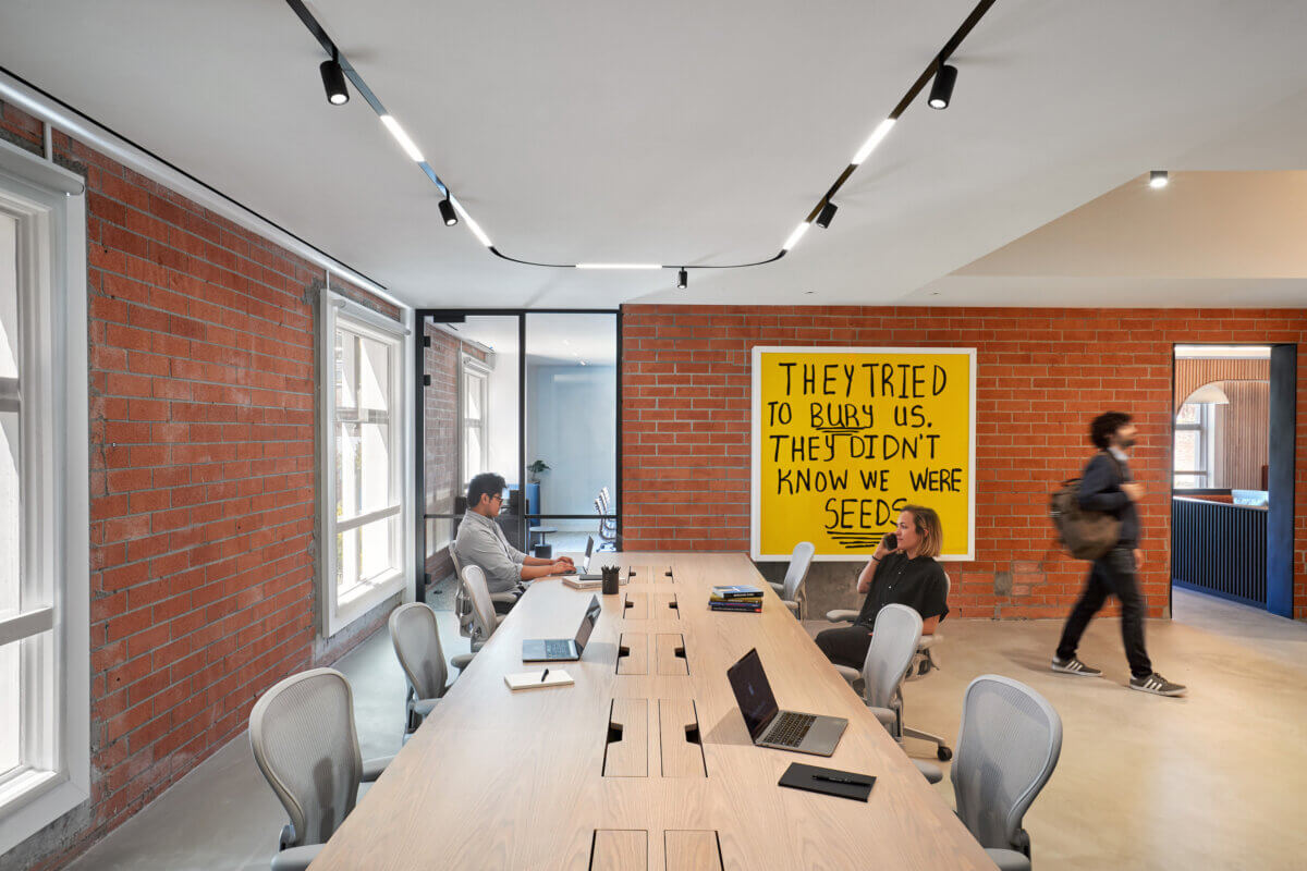 Communal workstations replace desks for remote workers with laptops