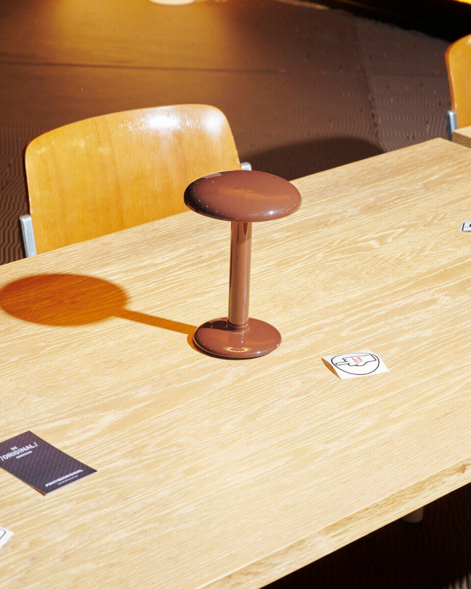Flos’ Gustave lamps in a lacquered brown finish
