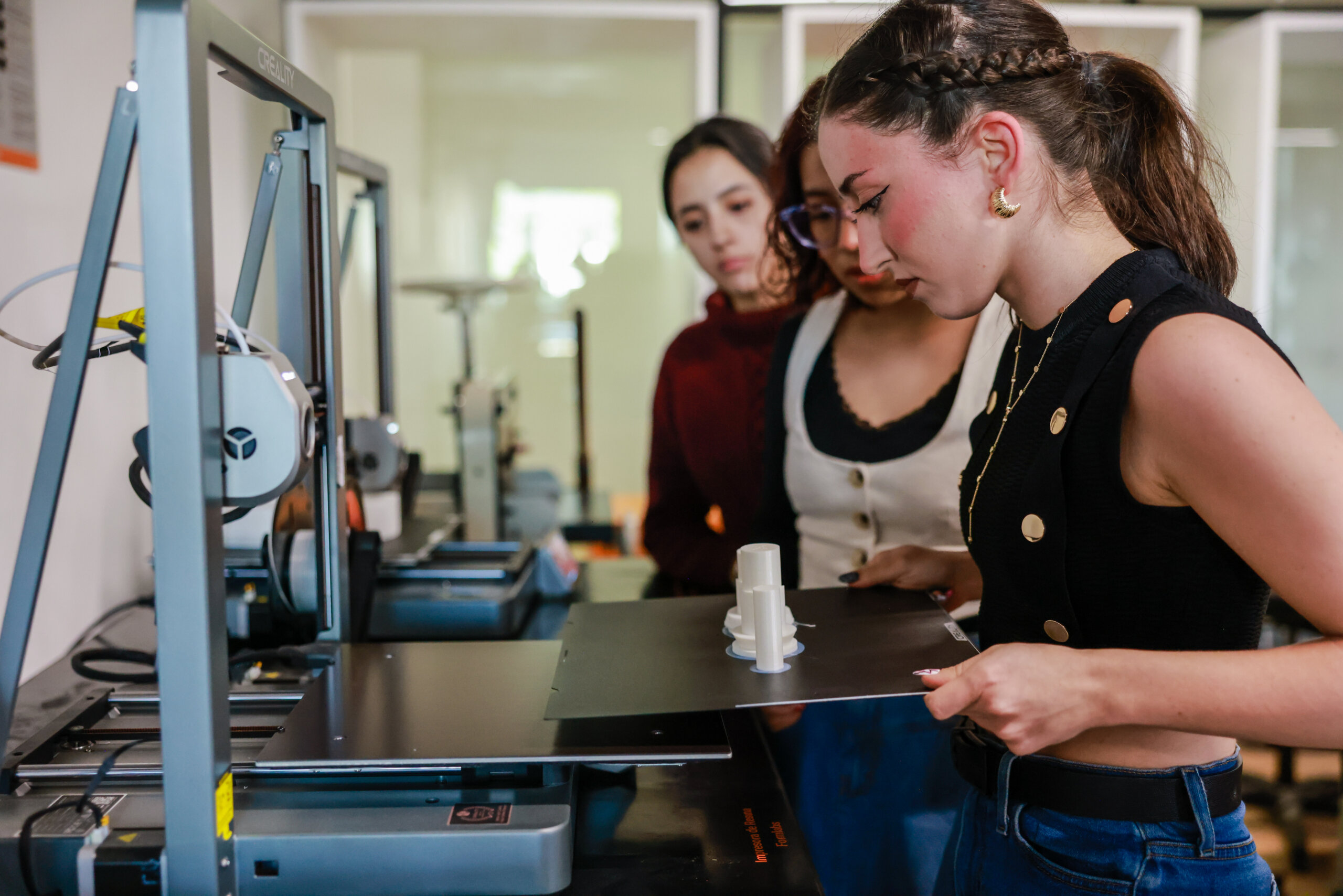An ICFF attendee reviews a book in the ICFF Library