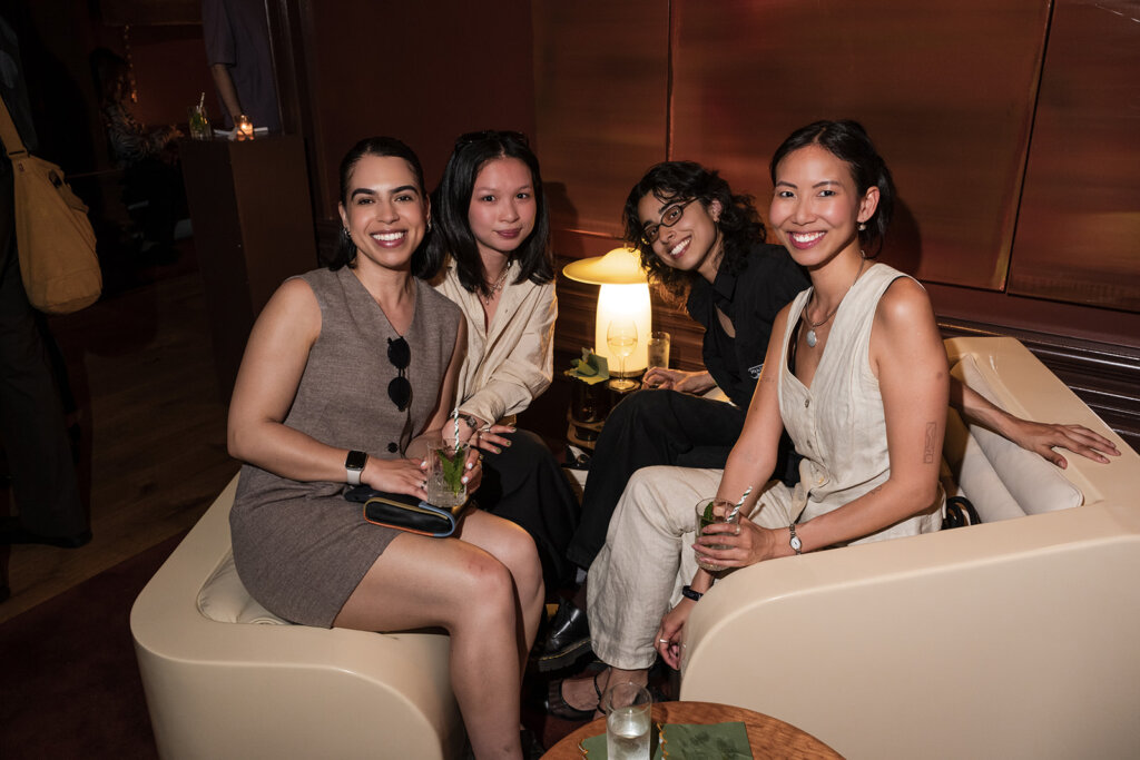 A group sitting on a furniture set from SUN SET at Look Book Offsite at Host on Howard