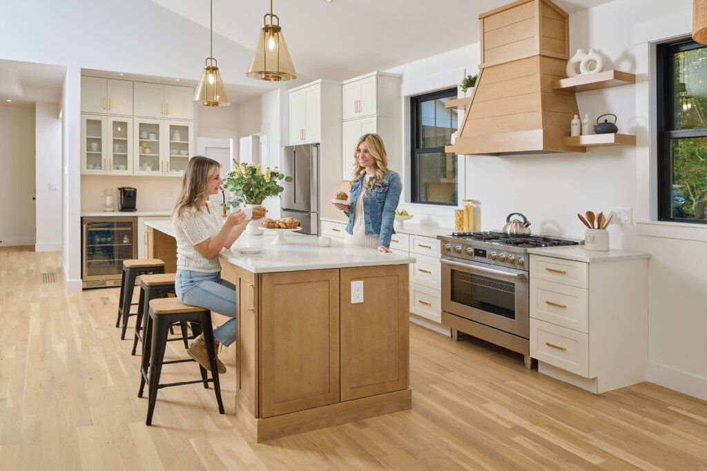Fabuwood Cabinets, women talking in kitchen