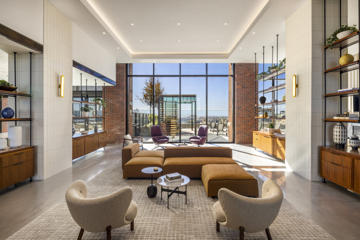 Open concept common area with large windows. By Cetra Ruddy Architects.