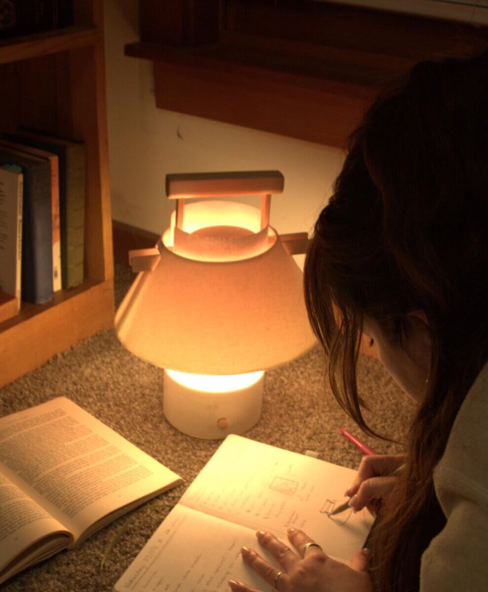 Noémie Debrun-Sittler's lamp in context of a student's desk late at night.