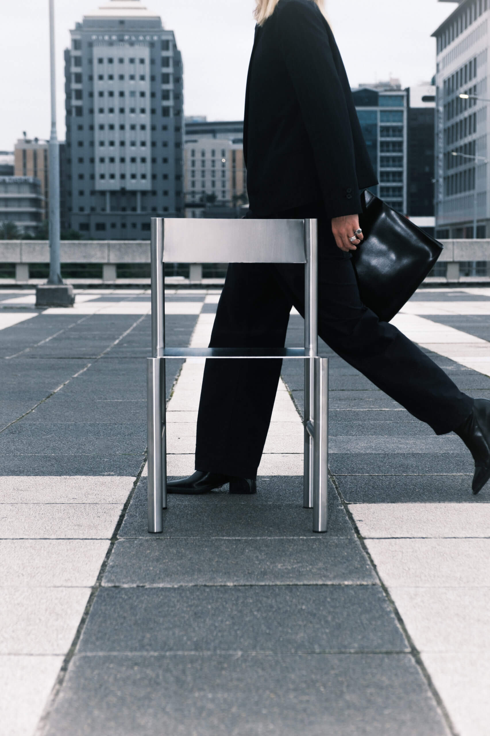 J O H N chair in street, metallic and monochrome hues (Image courtesy of N I S H)